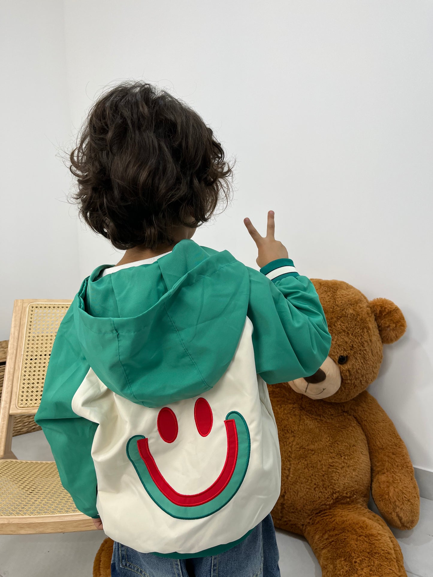 Veste smiley à capuche